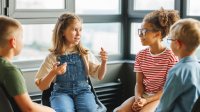 Elementary students in a small group discussion