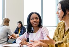 Two students talking in class