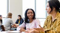 Two students talking in class