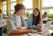 Two students talking in class