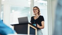 Woman speaking at a conference