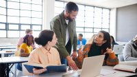 Teacher talking to students to help solve persistent classroom problems