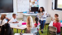 Photo of elementary school teacher with students