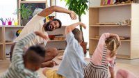 Photo of elementary school teacher stretching with students