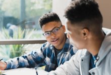 Photo of two students working together