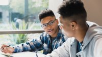 Photo of two students working together