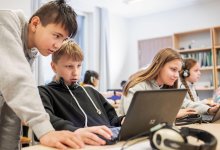 Photo of middle school students working on computers