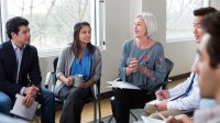 Woman leading a small group meeting