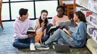 High school students reading books together