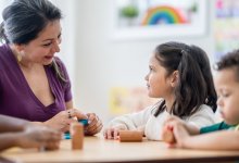 Preschool teacher working with students