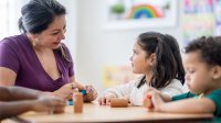 Preschool teacher working with students