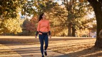 Photo of woman going for walk, representing strategies for work-free weekends