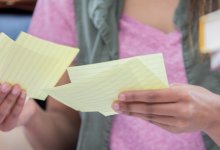 Photo of student looking at index cards