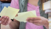 Photo of student looking at index cards