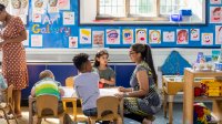 Paraeducator working with students