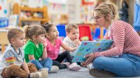 Pre-Kindergarten teacher reading book to students