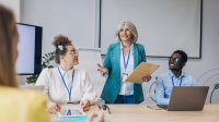 Woman leading staff meeting