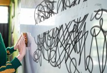 teacher erasing overwhelming scribble on whiteboard