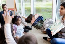 Photo of parent in early elementary school classroom