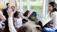 Photo of parent in early elementary school classroom