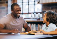 Photo of tutor working with student