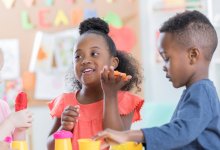 Photo of pre-school students playing in classroom