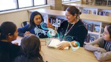 teacher reads to older students while book comes alive