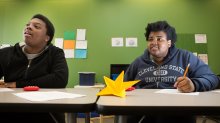 Students listening to their teacher in math class