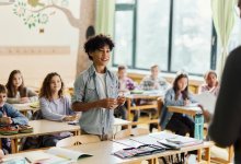 Student standing up and talking in class