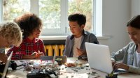 Photo of middle school students doing robotics