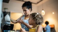 Photo of mother cooking with daughter at home