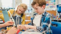 Elementary students working on a project together