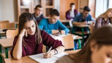 Photo of high school students writing in class