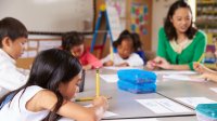 Photo of elementary school teacher with students