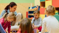 Photo of elementary school teacher and students