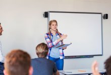 Photo of high school student speaking to class.