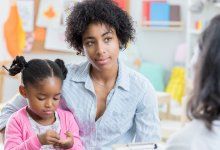 Photo of mother and child meeting with prek teacher about early intervention services