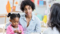 Photo of mother and child meeting with prek teacher about early intervention services