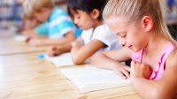 Elementary students reading books