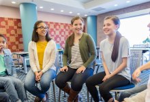 Students making the most of a quick check-in by participating in an SEL focused group discussions
