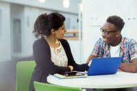Teacher talking to student