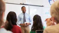 Teacher practicing a lesson in front of colleagues