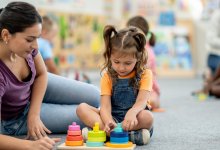 Photo of pre-k student and teacher in classroom