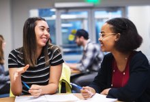 Photo of two high school students engaging in a design-thinking activity in language class