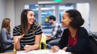 Photo of two high school students engaging in a design-thinking activity in language class