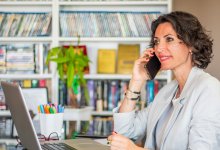 Teacher making a difficult phone call home to a student's family with confidence