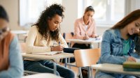 High school students completing a letter-writing assessment