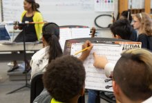 Students taking notes during band class