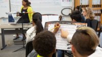 Students taking notes during band class