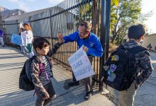 Principal John Maynard greets students as they return to Don Benito Fundamental School in Pasadena, CA on Wednesday, Jan. 29, 2025 after being closed for three weeks because of the Eaton fire.